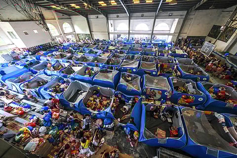 
HUNDREDS of distress residents of Isla Puting Bato, Tondo, Manila take refuge at the Leonardo B. Fugoso Sports Complex in Delpan after their houses were destroyed by fire. 
