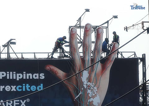 (October 06 2025) Workers seen installed billboard ads at Pasig City on Monday October 6 2025, The Philippine Atmospheric, Geophysical and Astronomical Services Administration (PAGASA) said on Monday, that a severe tropical storm with the international name “Halong” is unlikely to enter the Philippine Area of Responsibility (PAR) and will not have any direct impact on the country’s weather. Photo/Analy Labor
