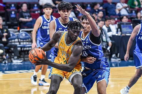 
MO Konateh flexes his muscles, leading the FEU Tamaraws to an impressive 64-58 win over the Adamson Falcons in Season 88 of the UAAP men’s basketball tournament.
