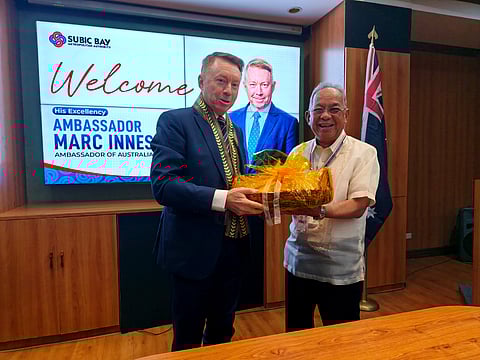 Australian Ambassador Marc Innes-Brown receives a tray of fresh Zambales mangoes from SBMA Chairman and Administrator Eduardo Jose L. Aliño during the diplomat’s visit to the Subic Bay Freeport on October 3, 2025. (Jonas Reyes)