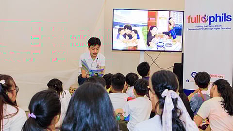 Emilio Baja, founder of Full Phils and author of 'A Heart in Two Places,' during his book reading with the community children of Manila.