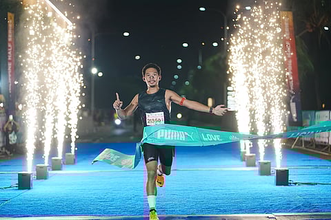 
SIMON Enriquez celebrates after ruling the men’s division of the PUMA Manila Half Marathon 2025 last Sunday at SM Mall of Asia Complex.  