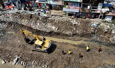 (October 09 2025) The Department of Public Works and Highways (DPWH) workers used backhoe to repair the damage wall, near the unfinished bridge, after collapsing months ago due to recent heavy rain brought by southwest monsoon at Tullahan River in SSS Village, Barangay North Fairview, Quezon City on Thursday October 9 2025. Photo/Analy Labor