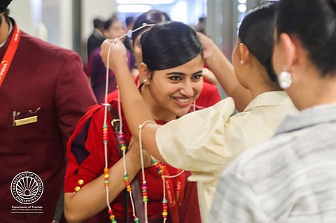 An Air India flight attendant receives a lei from a Department of Tourism personnel upon the arrival of Air India Flight AI 2361 at the Ninoy Aquino International Airport Terminal 1, signalling the start of non-stop direct flights from New Delhi to Manila.