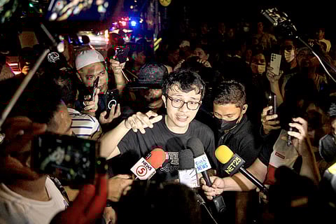 Cavite Representative Kiko Barzaga speaks to the media on Sunday night as they commence the protest rally in front of Forbes Park in Makati.