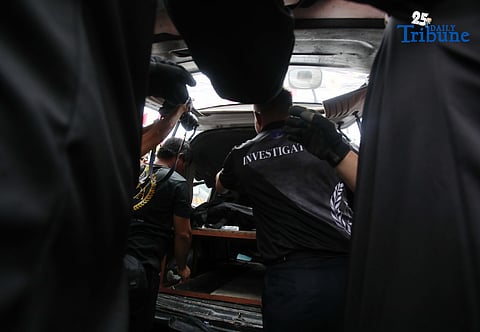QCDRRMO-USAR personnel carry the body bags of three siblings who died in a third-alarm fire that struck a residential area along P. Florentino Street in Barangay Sto. Domingo, Quezon City, on Tuesday. The victims, aged 10, 7, and 5, were trapped inside their home as firefighters battled the blaze. Authorities are still investigating the cause of the fire.