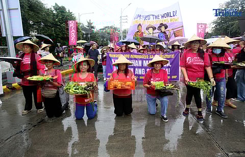 (October 15 2025)  Militant group Oriang, K4K, Asian Peoples’ Movement on Debt and Development (APMDD), Philippine Movement for Climate Justice (PMCJ), Aniban ng Manggagawa sa Agrikultura (AMA, carrying vegetables as symbolize of their protest and march to the Department of Agriculture in Quezon City, to demand food for people, and accountability in the massive corruption palauging the national government and landlessness among poor peasants as they mark International Rural Women's Day on Wednesday. Photo/Analy Labor
