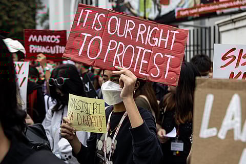 Hundreds of Mapúa University students walk out of their classrooms in Manila on Wednesday, 15 October 2025, to protest against widespread government corruption tied to anomalous flood control projects of the Department of Public Works and Highways.