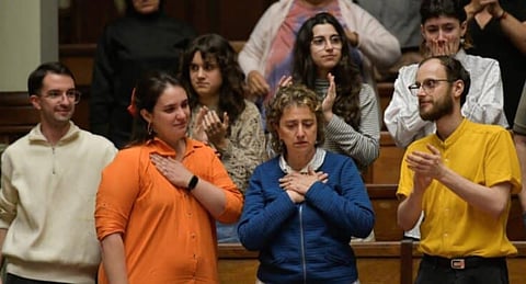 Florencia Salgueiro (L), a leading advocate for assisted dying in Uruguay, and her mother Rosana Rubio (C) celebrate the approval of the euthanasia law at the Legislative Palace in Montevideo on October 15, 2025. 