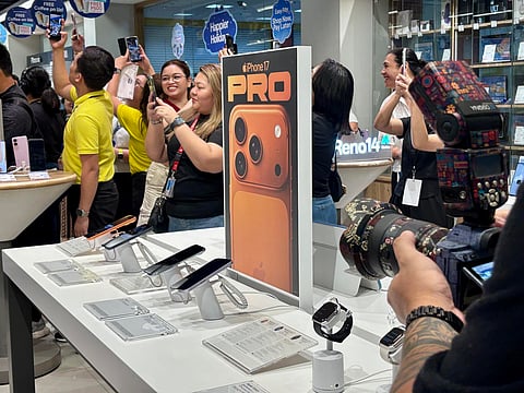 CUSTOMERS check out Apple’s newly launched iPhone 17 series at the Abenson–Bulacan branch in WalterMart Sta. Maria, Bulacan, during the midnight unveiling on 17 October. Home Credit Philippines offers the latest models for as low as P61 per day with 0 percent interest for up to 24 months.