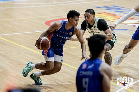
T-Mc Ongotan bangs in a career-high 28 points in Arellano’s 72-67 victory over Saint Benilde in the NCAA Season 101 men’s basketball tournament action Sunday at the FilOil EcoOil Centre.
