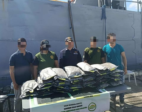 Personnel from the Philippine Navy and the Philippine Drug Enforcement Agency inspect thirty-two (32) packs of suspected marijuana “kush” recovered at Sabina Shoal, West Philippine Sea, and turned over at 2LT Lagare Pier in Puerto Princesa City on Monday, October 20, 2025. The seized contraband, valued at ₱19.2 million, was found floating inside a duffel bag during a naval patrol operation.