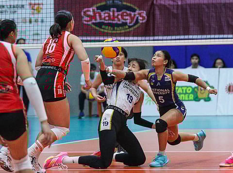 CELINE Marsh and Shaira Jardio of NU try to save the ball during their 2025 Shakey’s Super League Preseason Unity Cup quarterfinals against San Beda on Tuesday. 