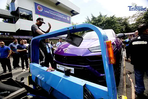 (October 21 2025) Land Transportation Office (LTO) and Bureau of Custom (BOC) personnel were assisting to load into tow truck the seized luxury car Lamborghini owned by a  Korean national, during the turnover to the BOC, held at LTO office in Quezon City on Tuesday October 21 2025.  LTO Chief Asst. Secretary Markus Lacanilao said that the dealer of the said luxury car is the same dealer of some luxury cars of the Discayas. Photo/Analy Labor
