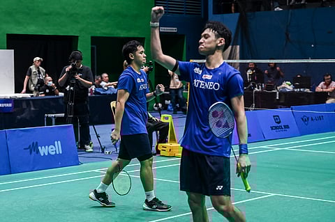 Graduating senior Arthur Salvado Jr. pumps his fist in triumph after his men's doubles tandem with JR Pandi completes Ateneo's finals sweep of UP to rule the UAAP Season 88 men's badminton competition.  
