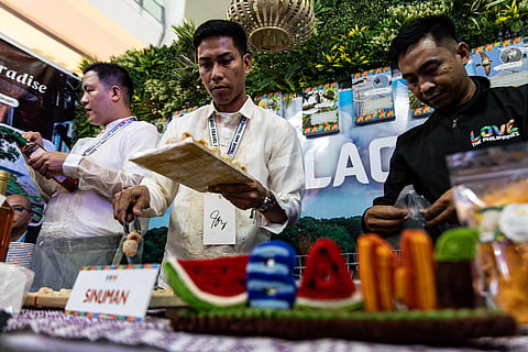 Top officials from the Department of Trade and Industry (DTI) and the Department of Tourism (DOT) light up the torch to formally open the Raniag Ti Amianan Travel and Trade Expo at a mall in Alabang, Muntinlupa City, on Wednesday, 22 October 2025. The event, organized in partnership with DTI and DOT Region 1, carries the theme “One Town, One Product, One Destination,” celebrating North Luzon’s rich culture, heritage, and craftsmanship.