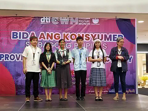 Contestants of the Spoke Poetry Contest pose with officials from the Department of Trade and Industry (DTI) Zambales during the awarding ceremony as part of the culminating activity for the Consumer Welfare Month at the Harbor Point Ayala Mall on October 23, 2025.