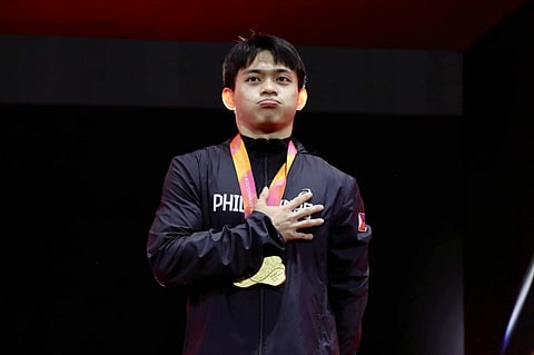 
Carlos Yulo oozes with pride while the Philippine national anthem is being played after clinching the men’s vault gold medal Saturday in the 53rd Artistic Gymnastics World Championships in Jakarta, Indonesia.