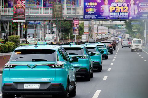A FLEET of Green GSM electric taxis lines up along EDSA as they mark another step toward sustainable city travel.
