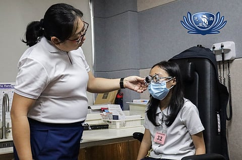 DR. Adriene Elizabeth Lim examines Aya Gail’s eyesight at the Tzu Chi Eye Center in Sta. Mesa, Manila.