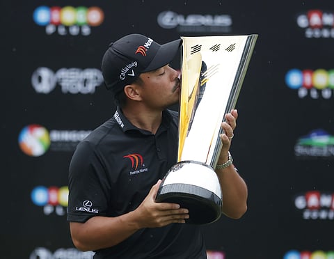 Home glory Overcome with emotion, Miguel Tabuena drops to the Sta. Elena green in triumph after clinching the International Series Philippines presented by Bingo Plus in Sta. Rosa, Laguna. Inset shows the Filipino ace kissing his trophy after a spectacular 7-under 65 sealed his fourth Asian Tour crown.