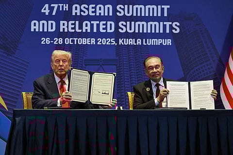 Strategic alliance US President Donald Trump (left) and Malaysia’s Prime Minister Anwar Ibrahim hold up signed documents sealing a critical minerals deal during a bilateral meeting on the sidelines of the 47th ASEAN Summit in Kuala Lumpur on 26 October.