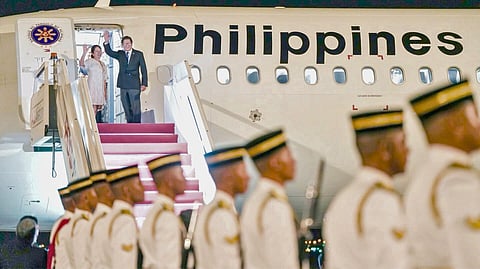 PRESIDENT Ferdinand Marcos Jr. and wife Liza Araneta-Marcos wave before boarding a Philippine Airlines return flight from Kuala Lumpur Airport in Malaysia after attending the 47th Asean Summit and Related Summits.