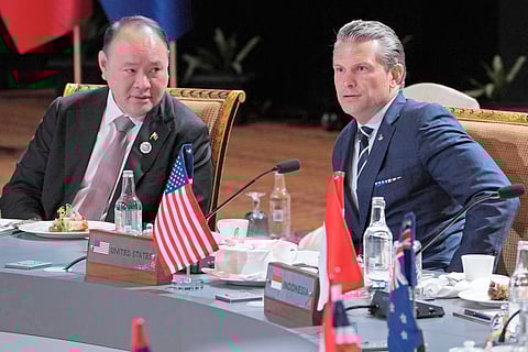 Defense Secretary Gilberto Teodoro Jr. (left) speaks with United States Secretary of Defense Pete Hegseth during the ministerial lunch at the Association of Southeast Asian Nations Defense Ministers’ Meeting in Kuala Lumpur on Saturday.