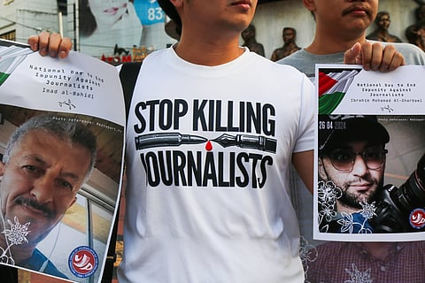 Journalists, students, human rights defenders, and press freedom advocates gather at the Boy Scouts Circle on Tomas Morato Avenue in Quezon City on the International Day to End Impunity for Crimes Against Journalists, 02 November 2025, as they commemorate the fallen journalists in Palestine and the Philippines who were killed while doing their duty.