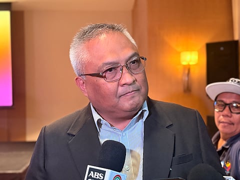 Globe President and CEO Carl Cruz speaks at a media briefing on Thursday, citing cybersecurity as a core priority as the telco expands its AI and cloud partnership with Amazon Web Services.