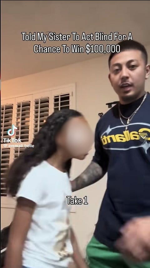 Screencap of a content creator making his sister participate in the "Emily Blind Prank" on TIkTok.
