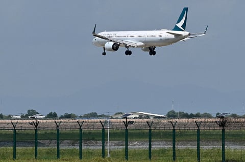 A Cathay Pacific Airbus A321-251NX prepares to land on the runway on the inauguration day of the newly built Techo International Airport in Kandal province, on the outskirts of Phnom Penh, on September 9, 2025. A new major airport serving the capital Phnom Penh began operations.