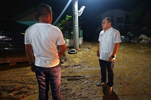 Go urges stronger support for urban poor as he checks on typhoon victims