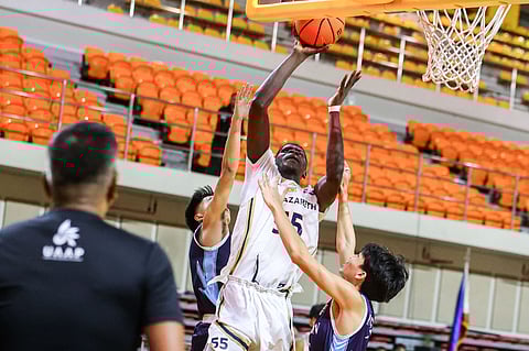 
MOUSSA Diakite asserts his dominance, dropping a triple double to lift the NUNS Bullpups to an 83-71 win over the Adamson Baby Falcons in Season 88 UAAP junior high school basketball tournament on Saturday. 