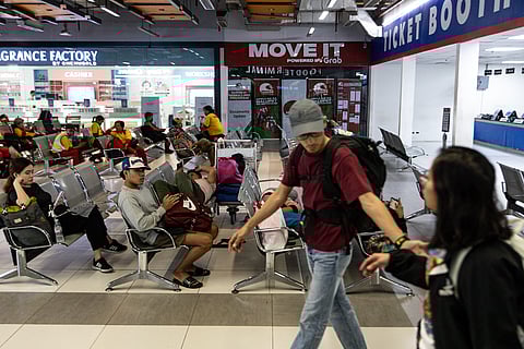 Some stranded passengers bound for Bicol region sleep on waiting area seats as trips are canceled due to Super Typhoon Uwan on Sunday, 9 November 2025.
