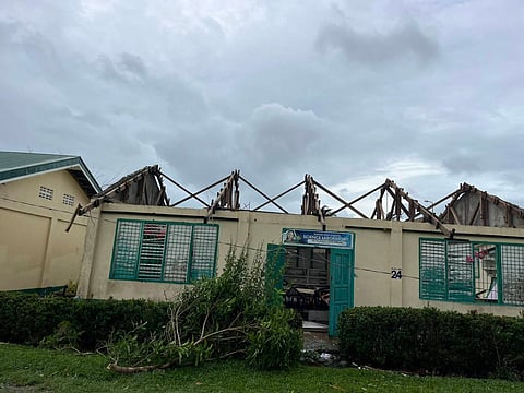 John Christian Turado Cabanban, a teacher from Casiguran National High School in Aurora, can’t help but become emotional after seeing the dilapidated roofs and other damage to their campus following the onslaught of supert typhoon ‘Uwan’ battered the province. 