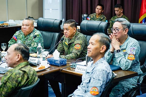 Armed Forces of the Philippines Chief of Staff General Romeo Brawner Jr. (middle) and other top key military officials discuss response plans for super typhoon ‘Uwan’ as he highlight troop deployments and relief efforts to assist affected communities. 