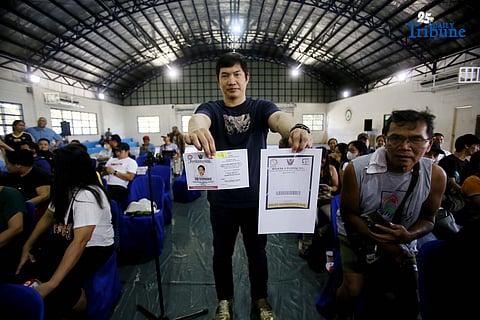 Carlos Montemayor, owner of Micesa 8 Gaming Inc., meets with Small Town Lottery (STL) agents at Camp Karingal in Quezon City, presenting samples of genuine versus fake STL identification cards. Montemayor and STL officials urged closer coordination with local authorities and the police to curb illegal number games such as “jueteng,” and reaffirmed full compliance with PCSO rules to safeguard bettors and STL players.