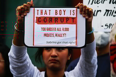 Students from Mapua University in Makati gather outside their campus in Pablo Ocampo Sr. Extension on 13 November 2025 as they call for justice and accountability from all officials and contractors involved in corruption. 
