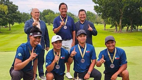 NGAP president Martin Lorenzo (above left) and secretary general Bones Floro (above right) celebrate with coach Ramon Brobio (above center) and players Chris John Remata, Perry Josef Buvay, Shiichi Suzuki and Rolando Bregente after winning their second Putra Cup crown on Friday.