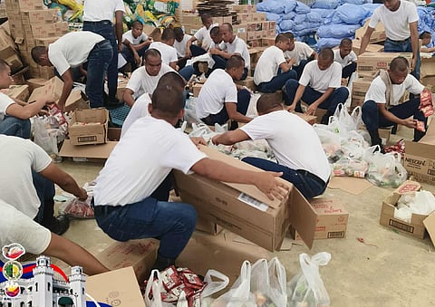 BuCor trainees lend hand Trainees of the Iwahig Prison and Penal Farm assist the Palawan Provincial Disaster Risk Reduction and Management Office in packing relief goods for Typhoon Tino victims in northern Palawan from 9 to 11 November. 