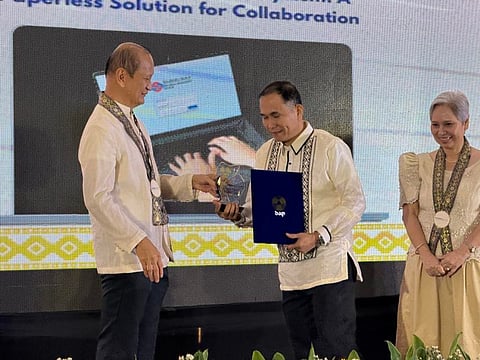 Office Services Department OIC Manager Jaime Menor receives the award from DAP President and CEO Leocadio S. Sebastian for saving one million sheets of paper for the agency’s paperless endeavor during the 2025 Powering Productivity event held at the Luxent Hotel in Quezon City on November 11, 2025.