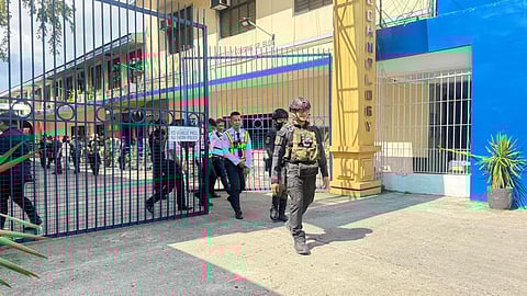 Security personnel of ISAT-U, along with the Explosive Ordnance Division of the Iloilo police, secure the university after it received another bomb threat. A wave of bomb threats disrupted classes and halted office operations in several major universities across Iloilo this month, prompting heightened security measures and a widening cybercrime investigation.