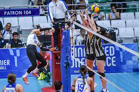 CHINNIE Arroyo of ZUS Coffee attacks two Nxled defenders during their PVL Reinforced Conference match last Tuesday. The Thunderbelles prevailed, 25-13, 25-21, 25-21.