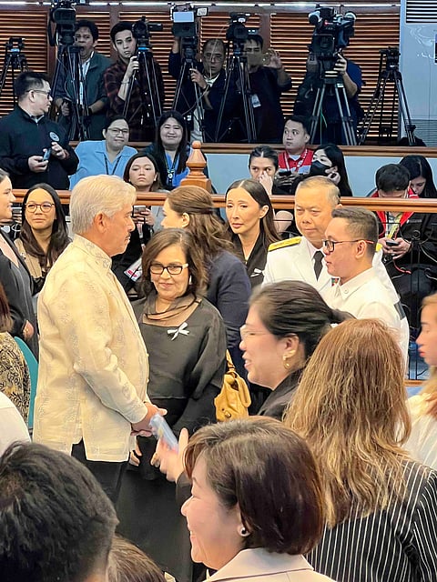 Senate President Tito Sotto talks to the bereaved family members of Chief Presidential Legal Counsel Juan Ponce Enrile during the necrogolical services held in his honor at the Philippine Senate in Pasay City on Wednesday.