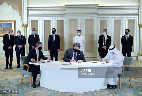 UAE-US-ISRAEL-DIPLOMACY
A handout image provided by United Arab Emirates News Agency (WAM) shows Emirati and Israeli delegates signing an agreement at the first Abraham Accords Business Summit in Abu Dhabi on October 19, 2020 in the presence of US Treasury Secretary Steven Mnuchin (back-C). Israel and UAE signed a US-brokered deal to normalise ties at the White House on September 15, marking the first such deal with a Gulf nation.
