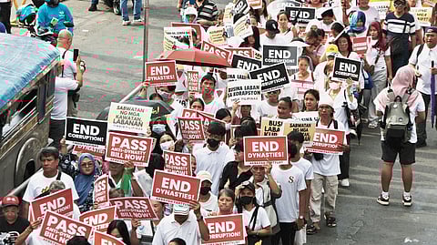 Anti-corruption march Progressive and faith-based groups parade through the Ortigas Central Business District on Sunday to call for an end to corruption and political dynasties.