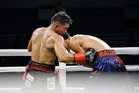 
Pedro Taduran digs to the body of compatriot Christian Balunan en route to a recent successful defense of the IBF crown. 