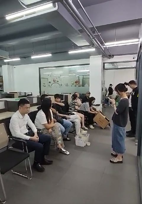 CHINESE nationals inside the raided office at the Sunland Building along Casal Street.