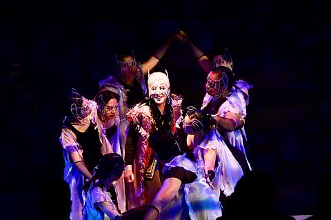Maita Ponce as Mephistopheles, with the ensemble of "Si Faust."